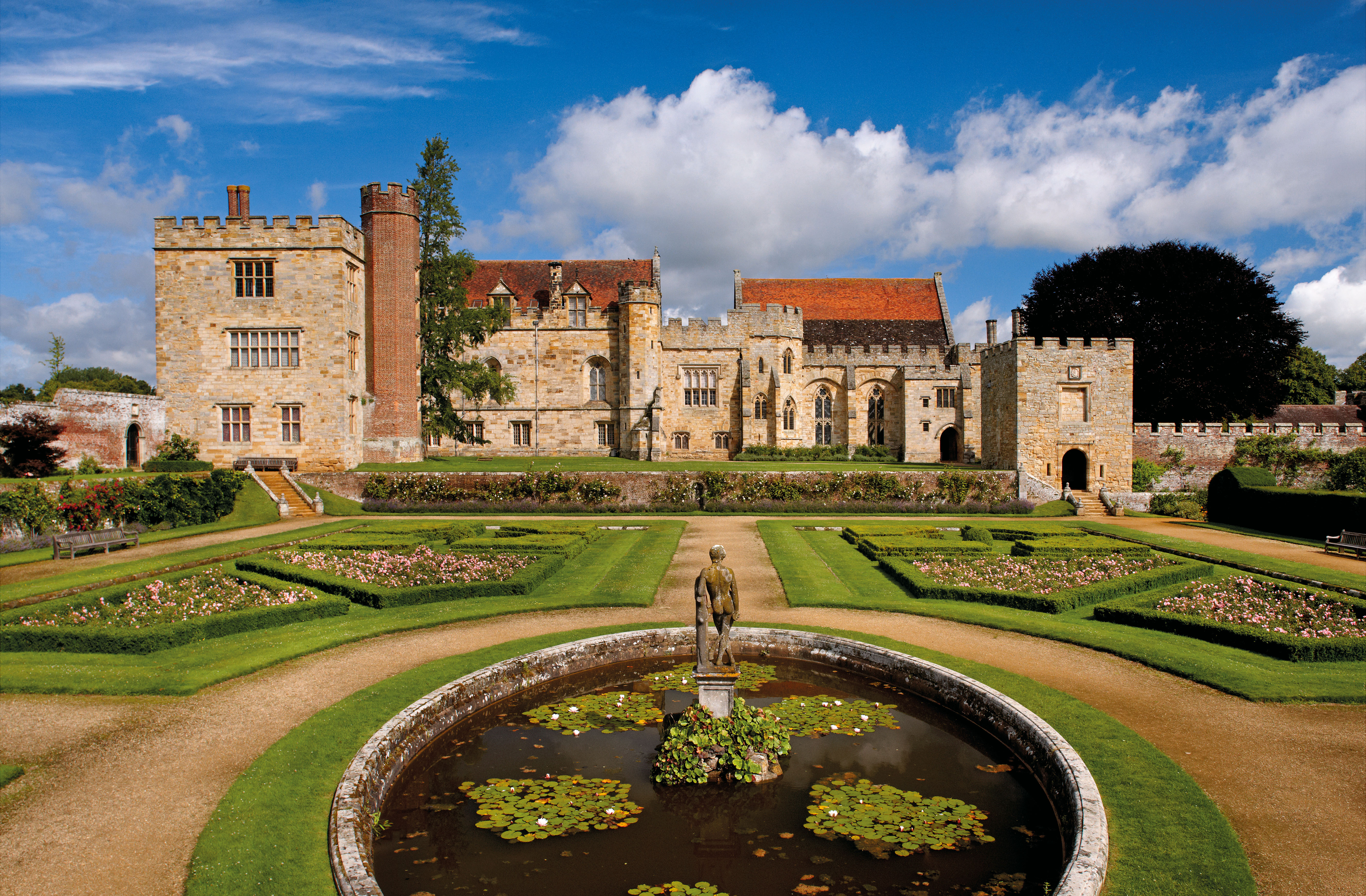 Penshurst Place gardens with water feature and the manor in the background