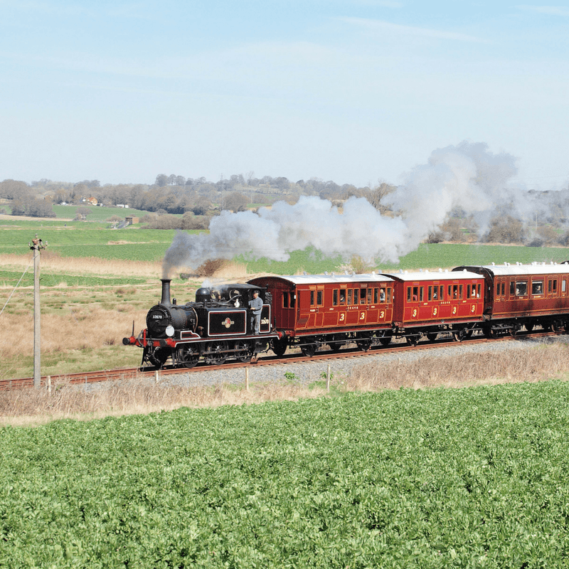 Kent and East Sussex steam train travelling through countryside