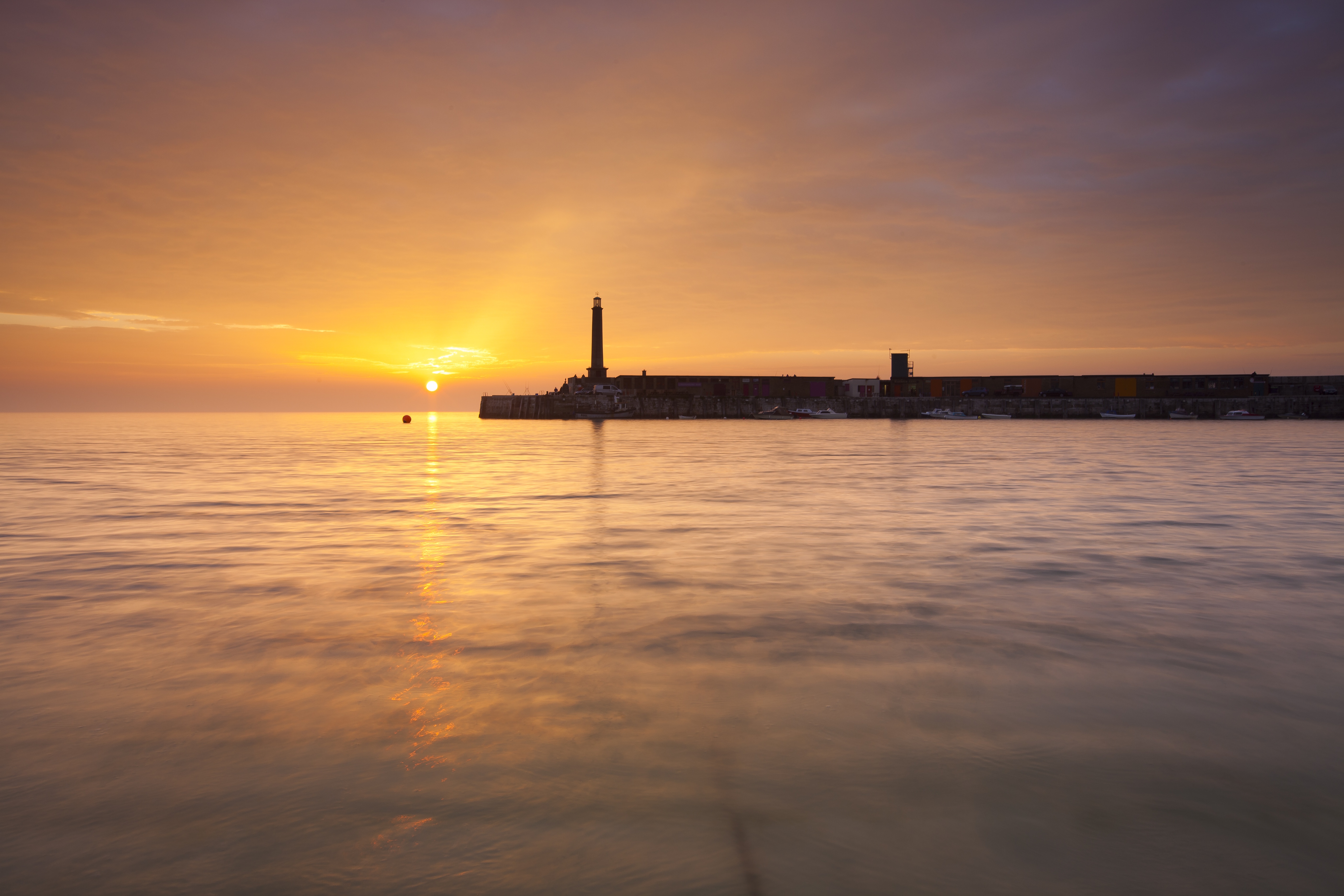 Margate Harbour Arm and sea at sunset