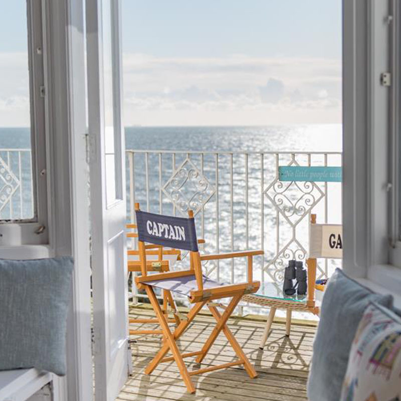 Directors chairs set on balcony with sea view