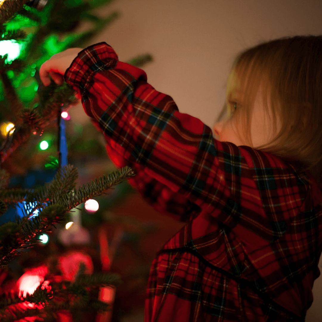 Child with Christmas tree